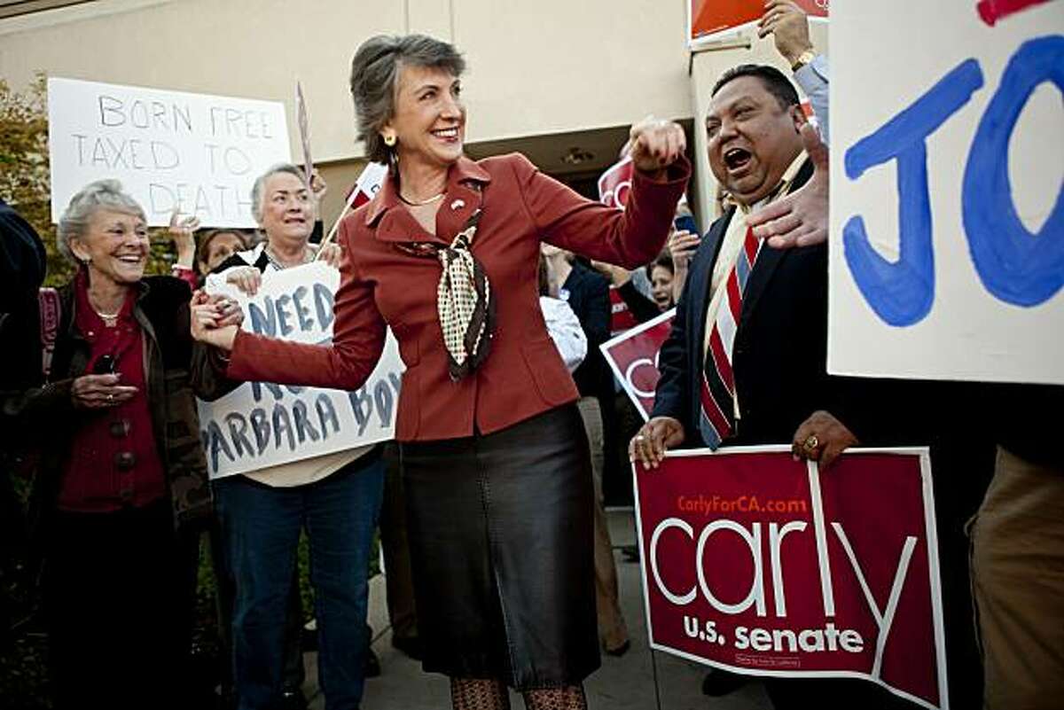 ELK GROVE, CA - NOVEMBER 1: Republican senatorial candidate and former head of Hewlett-Packard Carly Fiorina (C) greets supporters outside a GOP candidate phone bank November 1, 2010 in Elk Grove, California. Political campaigns are making their final push the day before the 2010 midterm elections. Fiorina is in a tight senate race against incumbent U.S. Sen. Barbara Boxer (D-CA).