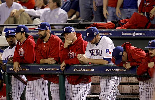 Texas Rangers' Josh Hamilton is congratulated by teammate Vladimir Guerrero  after hitting a solo homerun during the 5th inning against the San  Francisco Giants in game 3 of the World Series at