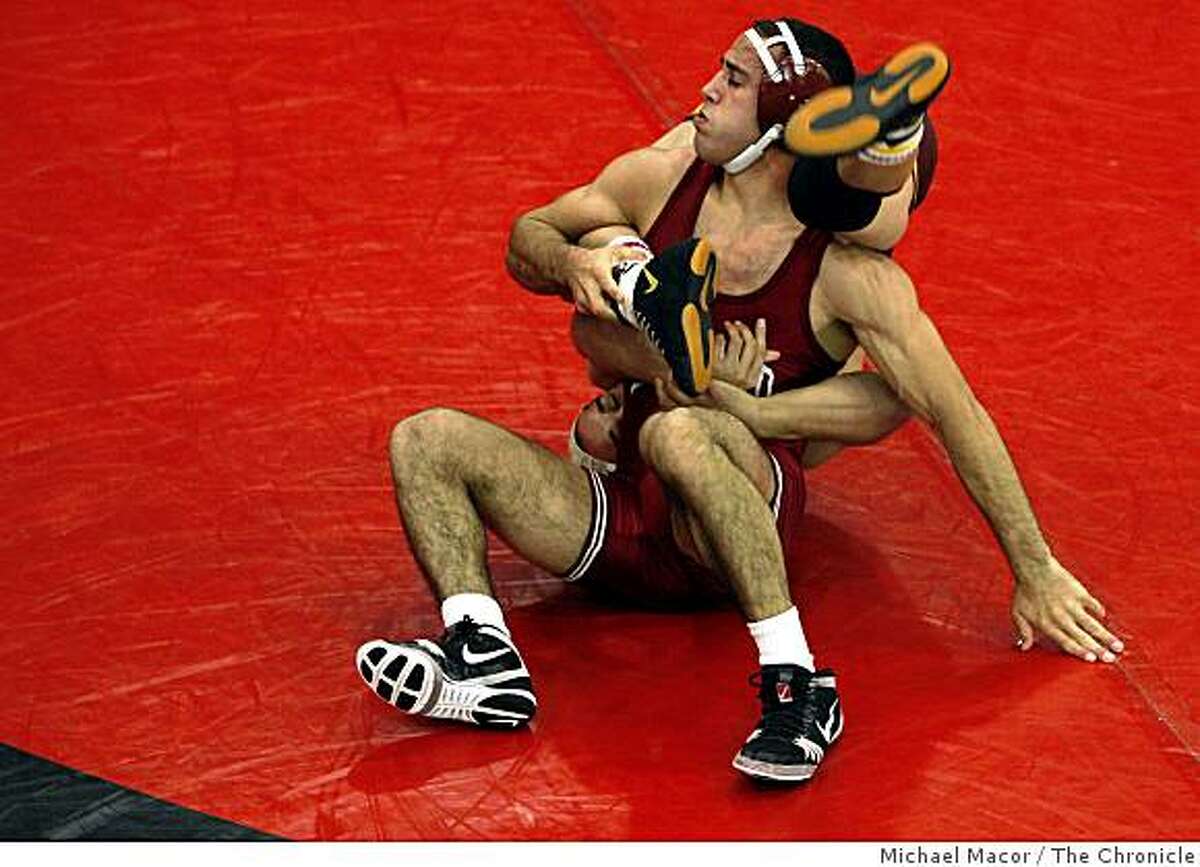 Stanford's Lucas Espericuerta, (front) turns his opponent, Te Edwards up-side-down as he went on to win his matche 20-3, as Stanford takes on Arizona State in wrestling on Friday Feb. 6, 2009 in Palo Alto, Calif. Stanford won with a score of 20-19.