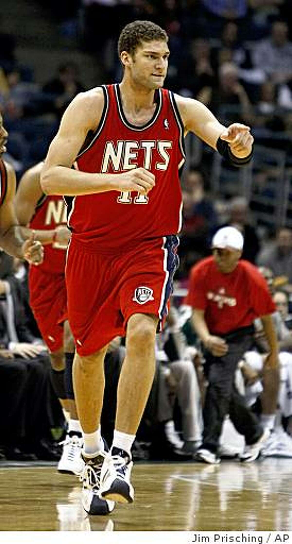 New Jersey Nets' Brook Lopez reacts after scoring a basket during the second half of an NBA basketball game Tuesday, March 3, 2009, in Milwaukee. The Nets beat the Milwaukee Bucks 99-95. (AP Photo/Jim Prisching)