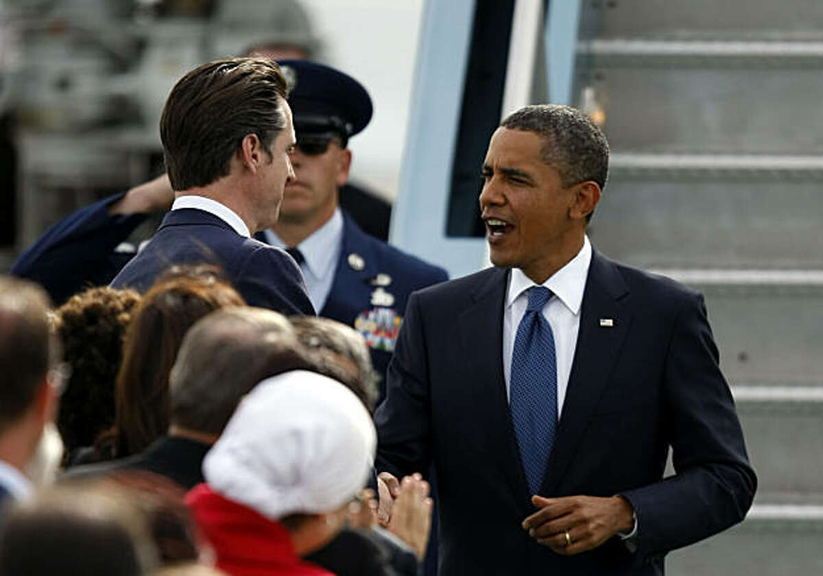 Mayor Gavin Newsom shakes hands with President Barack Obama as he arrives at San Francisco International Airport Wednesday, October 21, 2010, in San Francisco, Calif. Obama is campaigning to raise money for Democrats on a five-state and four-day trip.