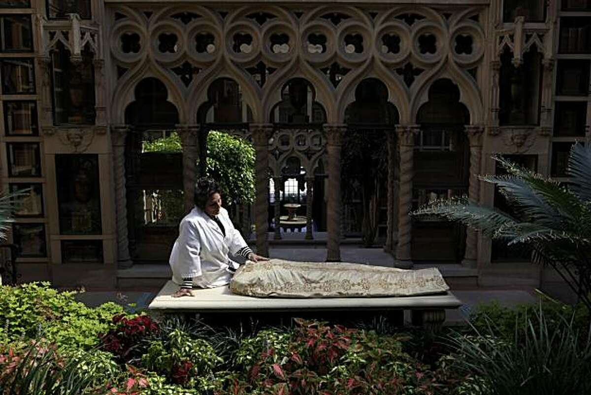 Esmerelda Kent runs Kinkaraco, a company that specializes in green burial products. One of her products is a burial shroud that is popular with those seeking a home funeral. She is shown here at The Chapel of the Chimes in Oakland, Calif., on Monday, October 18, 2010.
