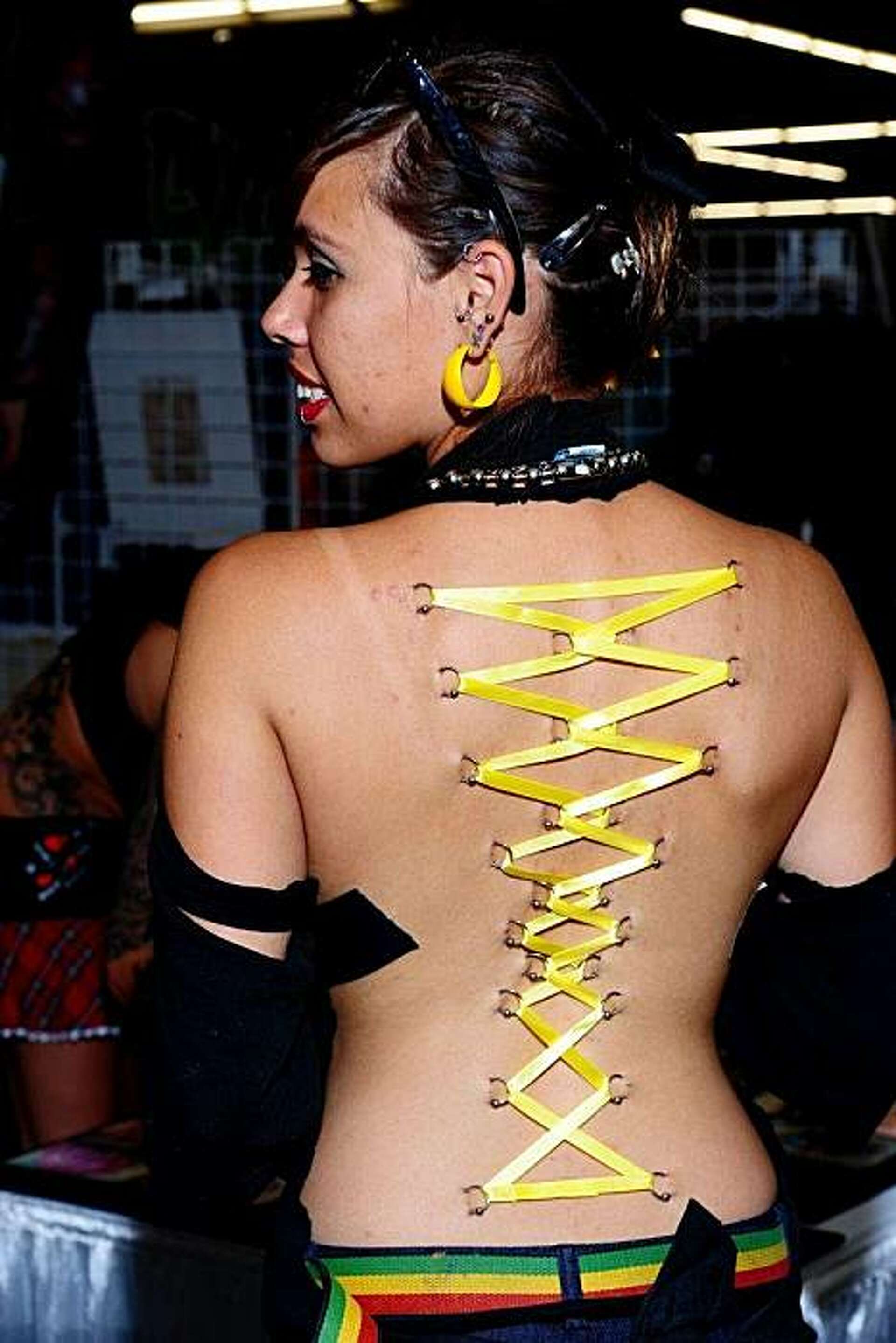 Corset piercings tug at perceptions of beauty