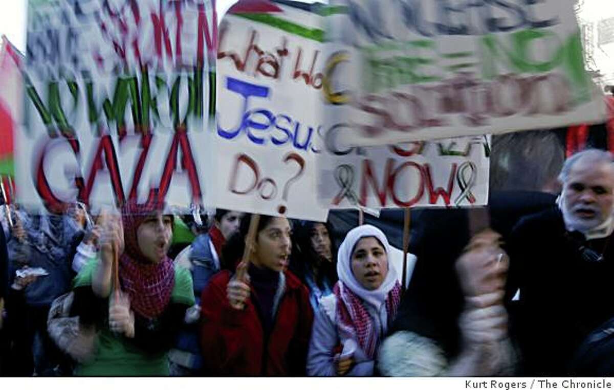 Pro-Palestinian demonstrators carrying signs march throughout The City on Saturday, Jan. 10, 2009 in San Francisco, Calif.