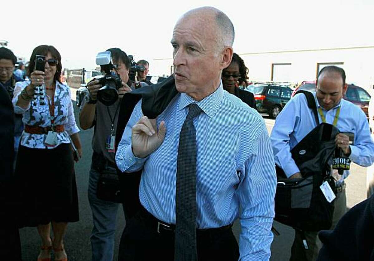 NEWARK, CA - SEPTEMBER 23: California attorney general and democratic gubernatorial candidate Jerry Brown arrives for a tour of PetersenDean Solar and Roofing on September 23, 2010 in Newark, California. Democratic gubernatorial candidate Jerry Brown toured the PetersenDean Solar and Roofing facility and held a news conference to discuss his opposition of California's Prop 23.