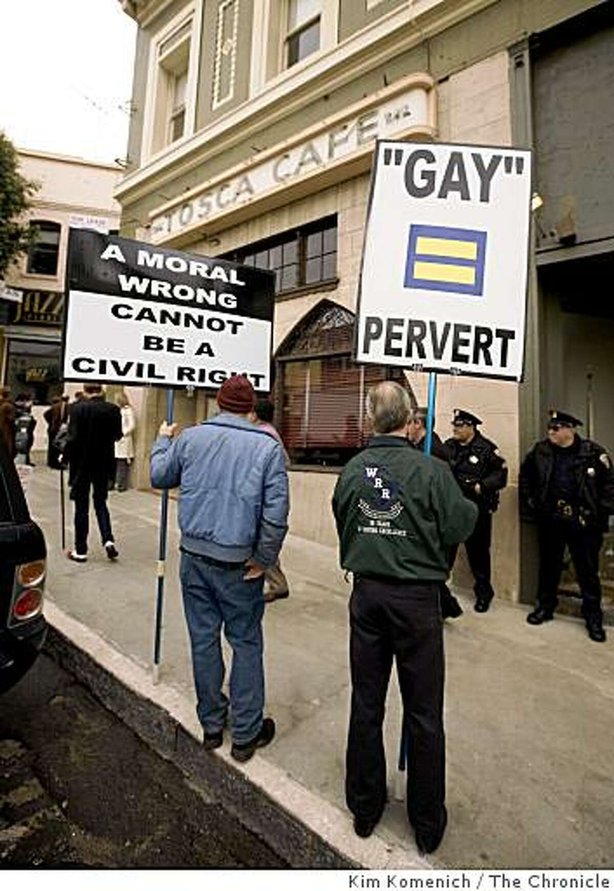 Two proesters hold signs outside the Tosca Cafe in San Francisco, Calif., on Tuesday, Mar. 3, 2009, where actor Sean Penn, who recently won an Academy Award for his portrayal of slain San Francisco Supervisor Harvey Milk, spoke at a press conference announcing the reintroduction of California Senate Bill 572. The bill, authored by State Senator Mark Leno of San Francisco, would designate May 22 as Harvey Milk Day