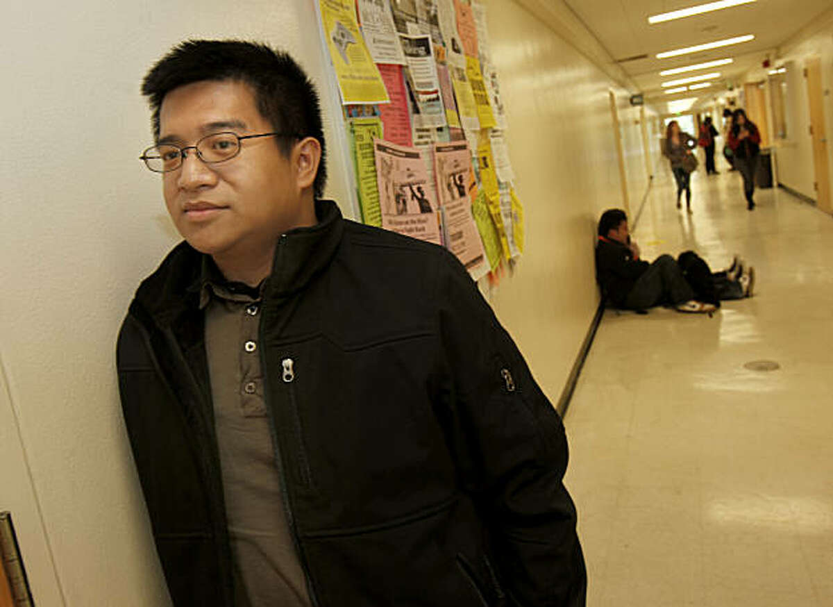 Bryan Guillermo waits in the hallway for a class in the HSS building on the SF State University campus. Bryan Guillermo took over four years to transfer from a junior college to San Francisco State University where he is a psychology major.