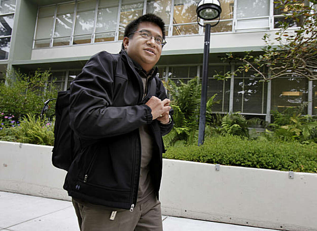 Bryan Guillermo walks through a courtyard at SF State University Tuesday October 19, 2010. Bryan Guillermo took over four years to transfer from a junior college to San Francisco State University where he is a psychology major.