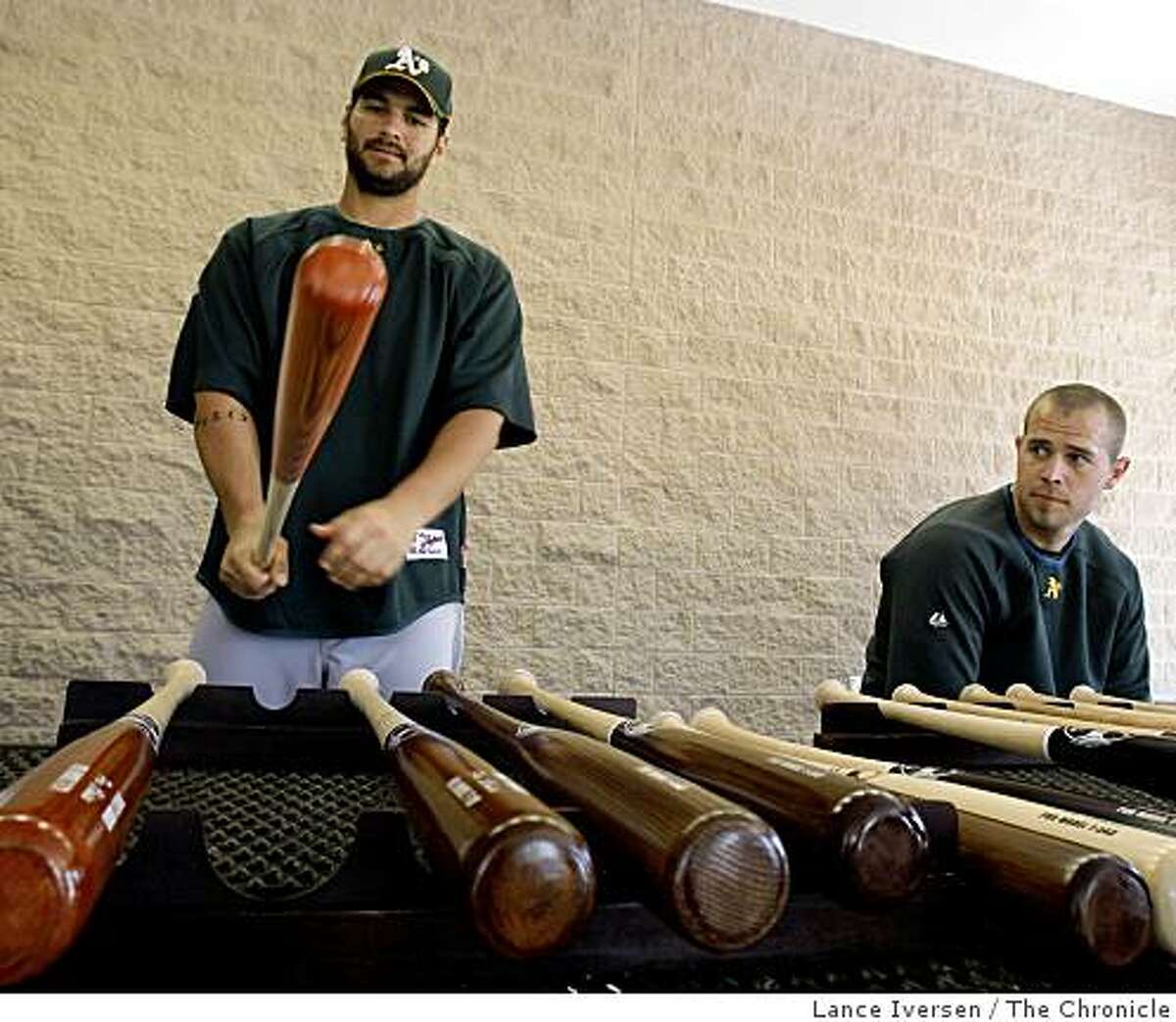 Oakland Athletics Eric Chavez and Bobby Crosby test drive custom bats by Trinity Bat Co, from Fullerton Ca outside the Spring Training club house at Papago Baseball Complex Frisday February 20, 2009 in Phoenix Arizona