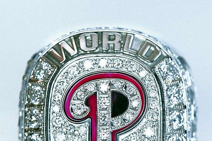 An Atlanta Braves fan shows off a replica World Series ring that
