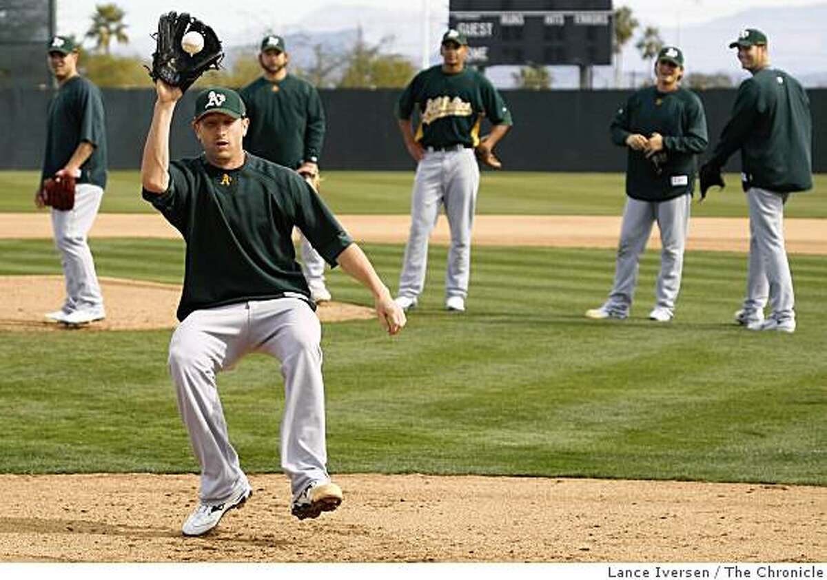 Oakland Athletics pitcher Dallas Braden runs down a ground ball during a Spring Training workouts at the Papago Baseball Facility Sunday February 15, 2009 in Phoenix Arizona