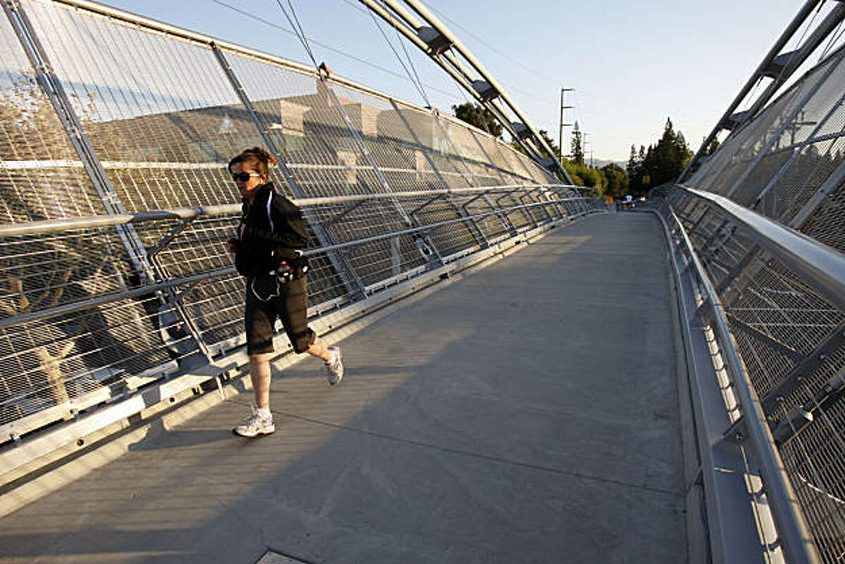 Erin Stampa jogs on the new pedestrian bridge over Treat Blvd. near Pleasant Hill BART station in Pleasant Hill, Calif. on Sept. 07, 2010.