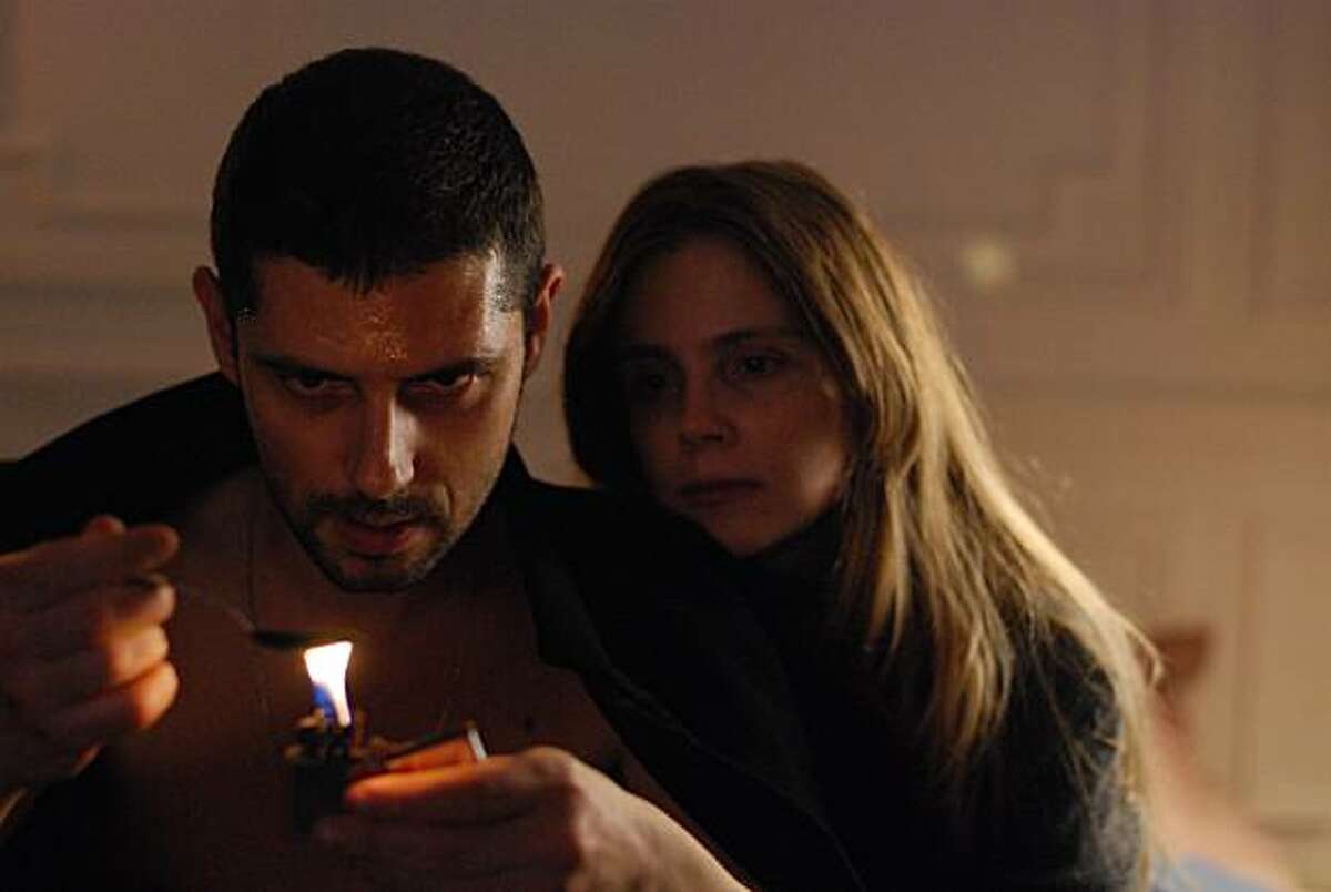 Melvil Poupaud and Isabelle Carre appear in a scene from, "Hideaway."
