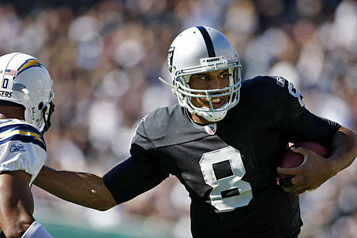 The Oakland Raiders quarterback Jason Campbell makes a run towards the goal making a first down in the second quarter of the game against the San Diego Chargers at the Oakland-Alameda County Coliseum, Sunday Oct. 10, 2010, in Oakland, Calif.