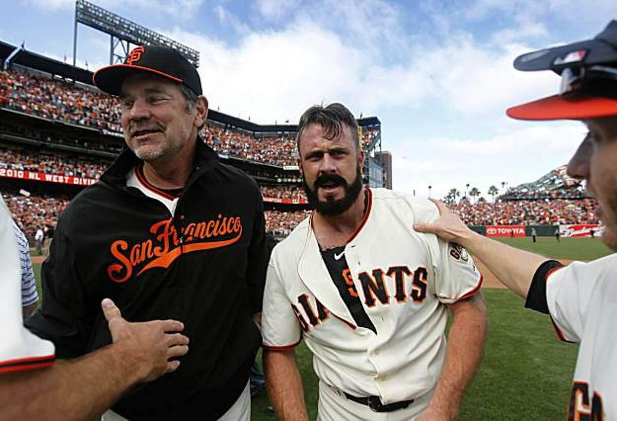 Giants manager Bruce Bochy and closer Brian Wilson celebrate a 3-0 win over the San Diego Padres and the NL West title at AT&T Park on Sunday.