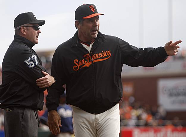 Giants manager Bruce Bochy and closer Brian Wilson celebrate a 3-0 win over  the San Diego Padres and the NL West title at AT&T Park on Sunday. (Paul  Chinn/San Francisco Chronicle via