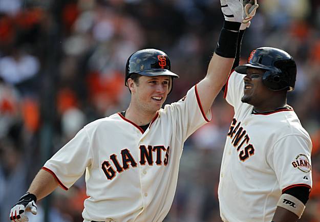 Pat Burrell, Brian Wilson and Aubrey Huff begin the celebration as