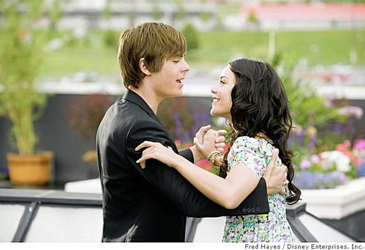 In this image released by Disney Enterprises, Zac Efron, left, and Vanessa Hudgens are shown in a scene from, "High School Musical 3."