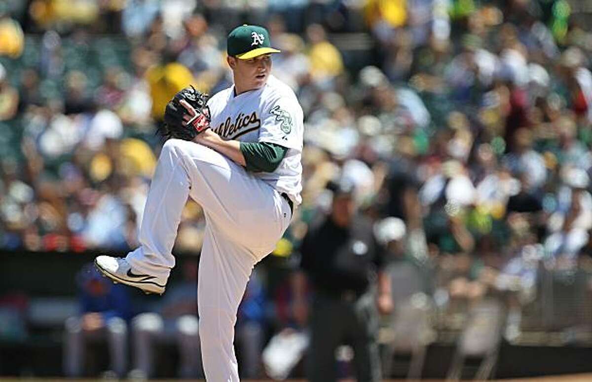 OAKLAND, CA - AUGUST 08: Trevor Cahill #53 of the Oakland Athletics pitches against the Texas Rangers during an MLB game at the Oakland-Alameda County Coliseum on August 8, 2010 in Oakland, California. (Photo by Jed Jacobsohn/Getty Images)