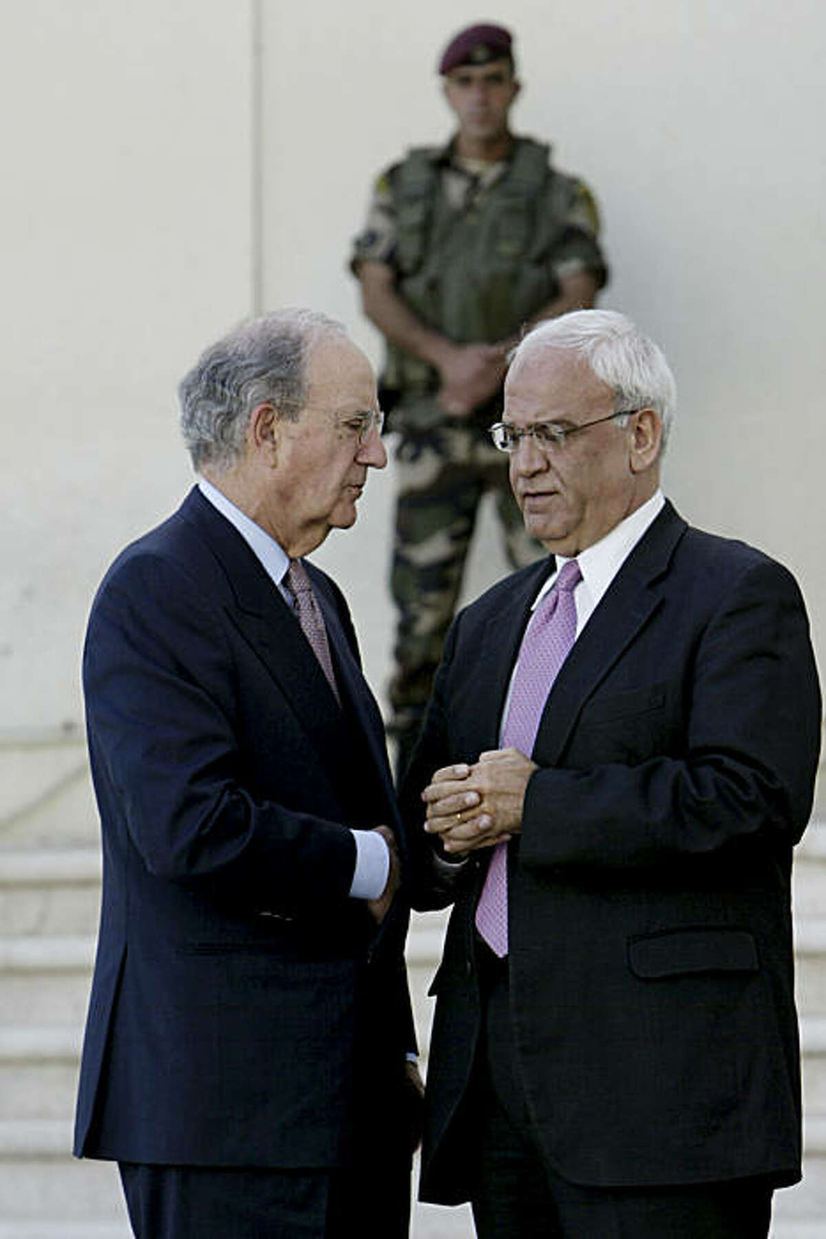 Special Envoy for Middle East Peace George Mitchell, left, and Chief Palestinian negotiator Saeb Erekat, right,are seen after a meeting with Palestinian President Mahmoud Abbas, in the West Bank city of Ramallah in the West Bank city of Ramallah, Thursday, Sept. 30, 2010. A U.S. emissary racing against the clock to salvage Mideast peace negotiations scheduled another quick round of meetings with Israeli and Palestinian leaders after talks Thursday with Palestinian President Mahmoud Abbas ended inconclusively.