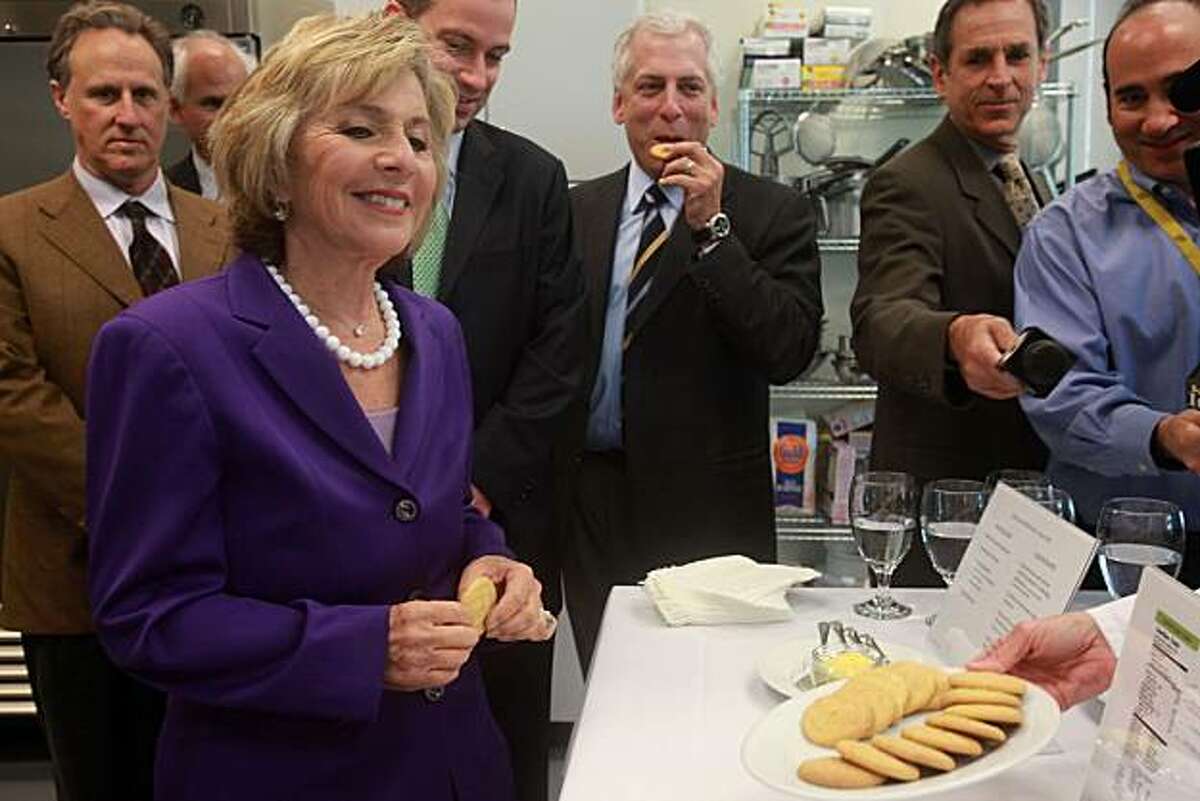 U.S. Senator Barbara Boxer (D-CA, left) presented with cookies made with algal flour at Solazyme, Inc. in South San Francisco, Calif., on Tuesday, September 7, 2010. Solazyme is pioneering algae-based diesel and jet fuels and has received several federal grants and contracts to help the U.S. Navy reach its goal of operating 50 percent of its fleet on renewable fuels by 2020.