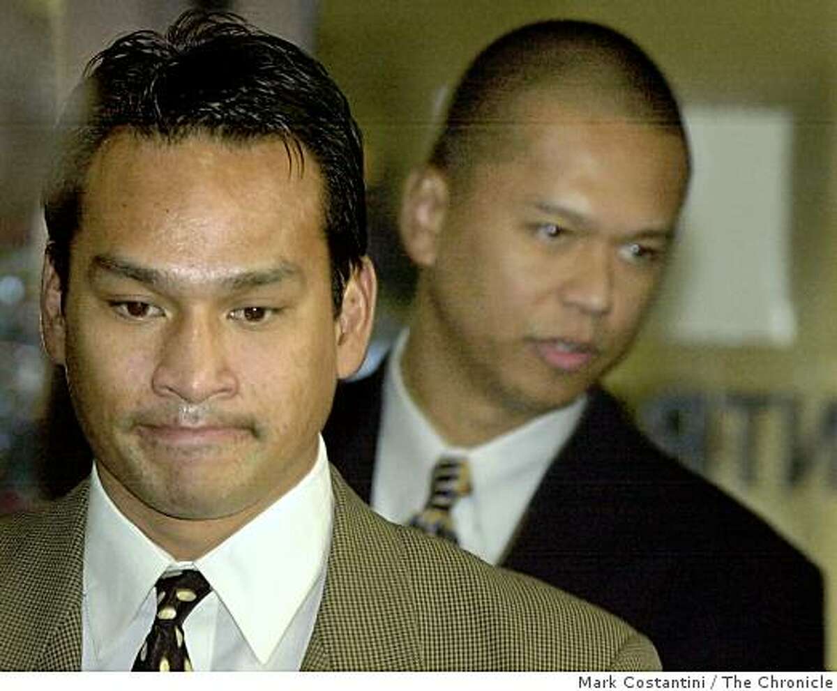 RIDERS07a-C-06DEC00-EZ-MC. (l-r) Jude Siapno and Clarence "Chuck" Mabanag, two Oakland cops known as "The Riders" enter the Alameda County Superior Court in Oakland today. Photo by Mark Costantini/Chronicle ALSO RAN 5/31/2001, 4/29/02, 9/18/02, 02/19/03, 5/30/03, 08/31/03, 9/12/2003, 10/01/03, 10/02/03