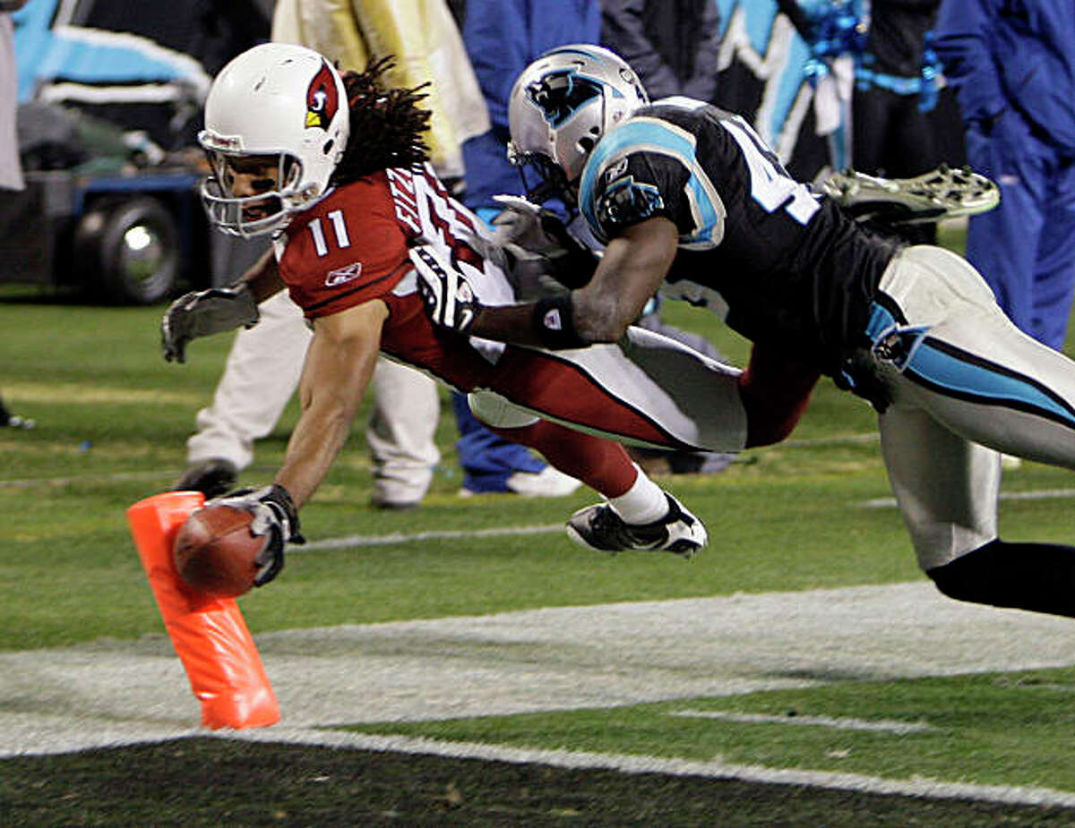 Arizona Cardinals' Larry Fitzgerald aided by Hines Ward