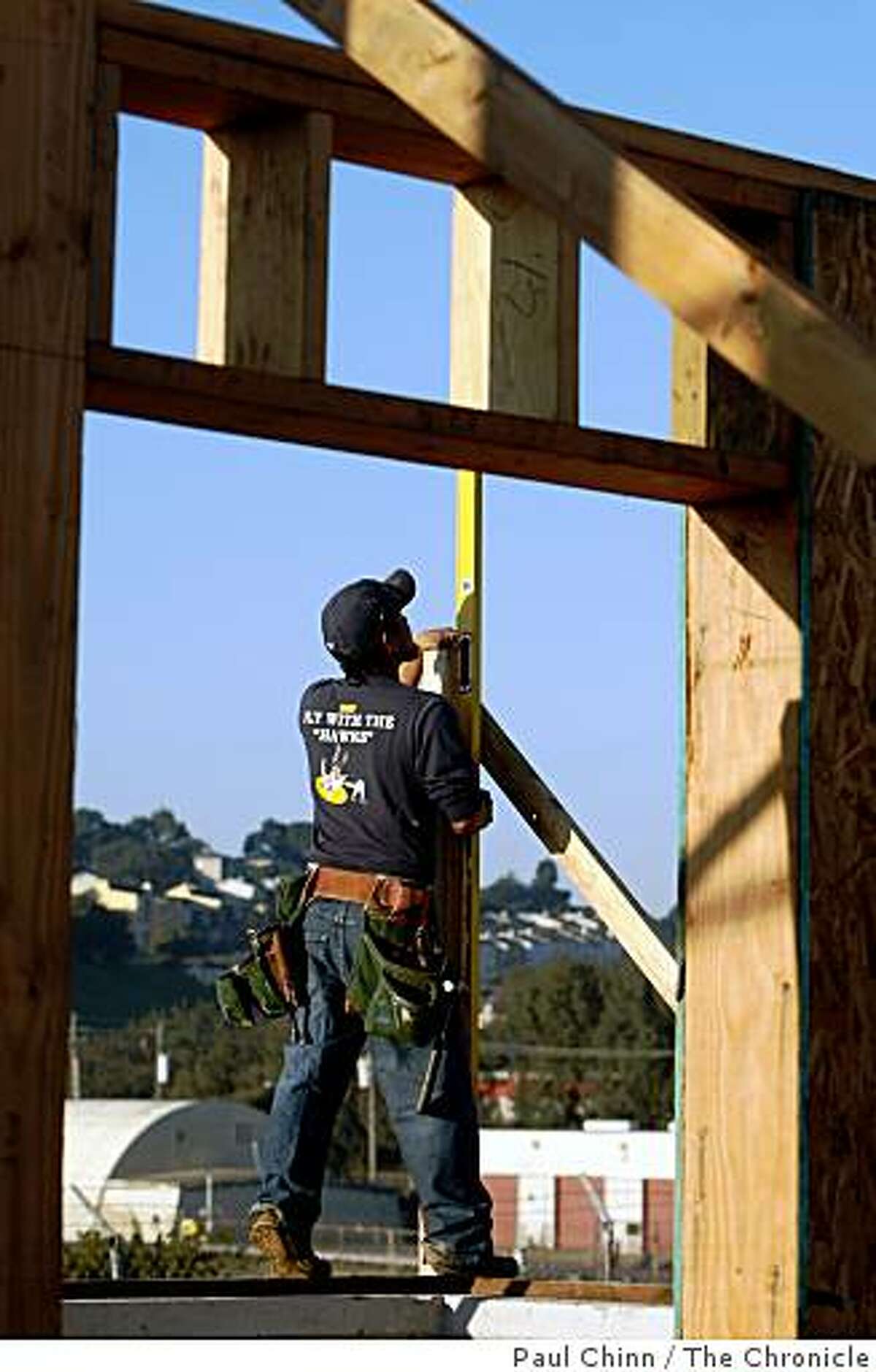 Alex Martinez levels a beam at the EcoCenter construction site at Heron's Head Park in San Francisco, Calif., on Thursday, Jan. 15, 2009. Construction of the environmentally-conscious interpretive center, slated to open in April, may be stalled because of the ongoing state budget crisis.