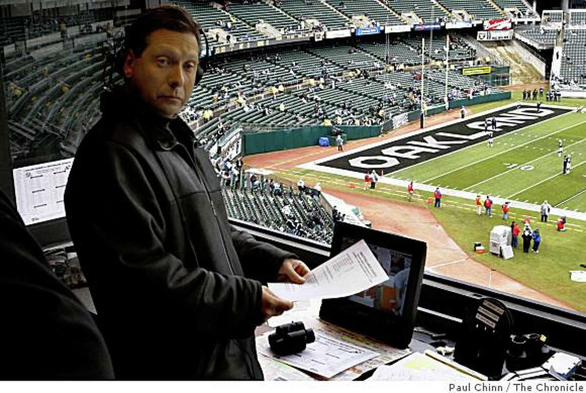 Oakland Raiders radio play-by-play announcer Greg Papa prepares for the game against the New England Patriots in Oakland, Calif., on Sunday, Dec. 14, 2008.