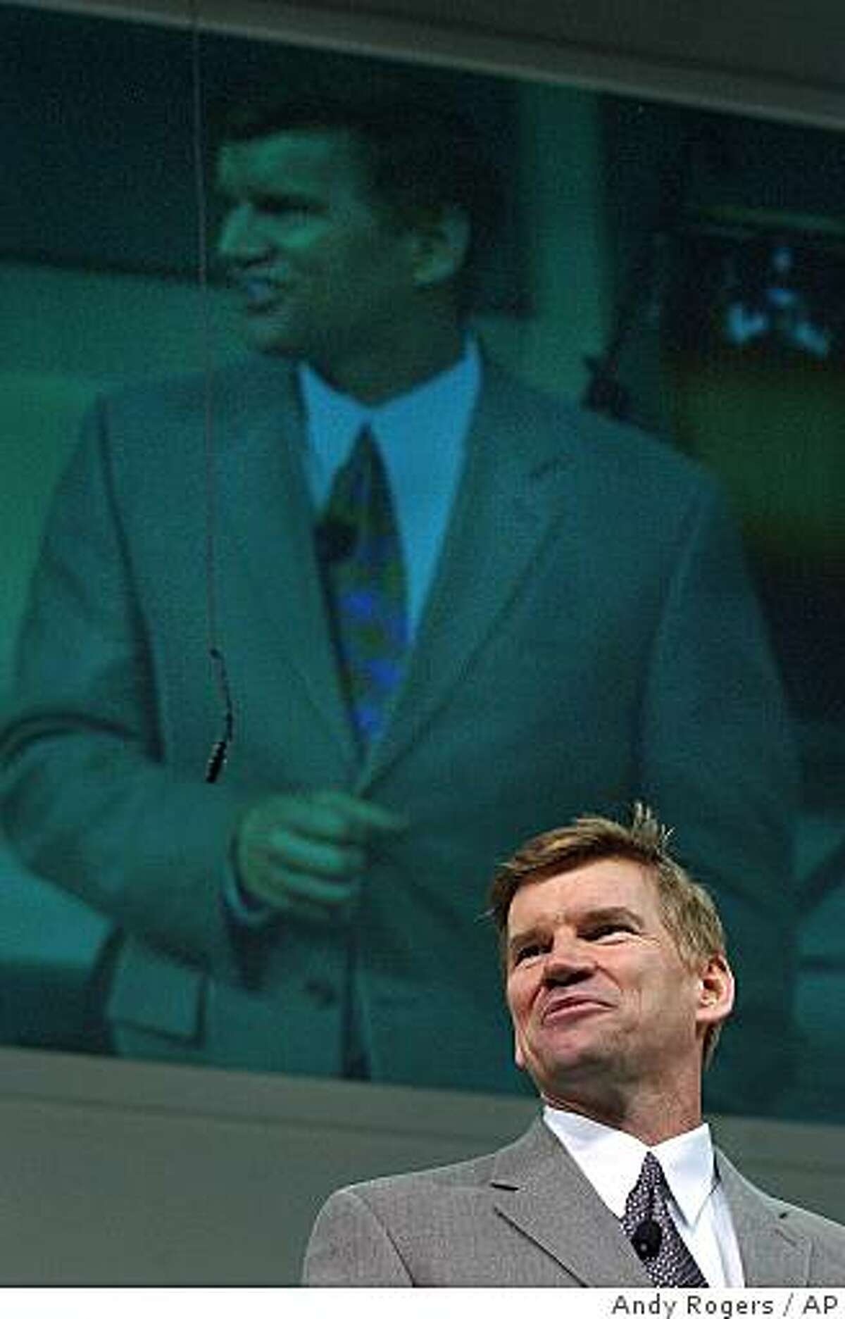 Below a live video feed of himself, the Rev. Ted Haggard delivers a sermon to those gathered at the New Life Church in Colorado Springs, Colo., in 2002.