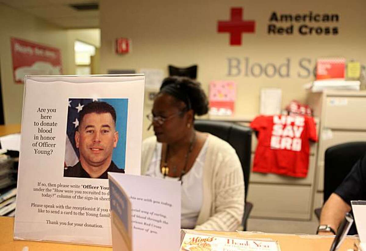 A sign inside the American Red Cross Blood Donation Center on Claremont Avenue reminds people to donate blood in an effort to help wounded Fremont Police officer Todd Young on Monday Sept. 6, 2010 in Oakland, Calif. East Bay blood banks were open on Labor Day to help the officer.