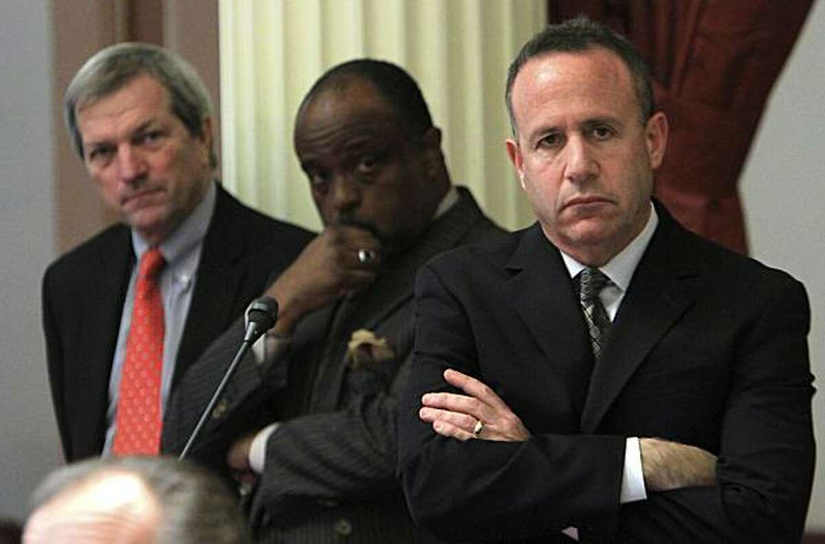 State Senate President Pro Tem Darrell Steinberg, D-Sacramento, right, along with Sen. Rod Wright, D-Inglewood, center, and Sen. Mark DeSaulnier, D-Concord, listen as Sen. Bob Huff, R-Diamond Bar, unseen, speaks against a Democratic budget plan before theSenate at the Capitol in Sacramento, Calif., Tuesday, Aug. 31, 2010. Lawmakers rejected two different versions of the state budget, one, proposed by the Democrats and the other, a Republican plan, leaving the state two months into the 2010-2011 fiscal year without a spending plan.