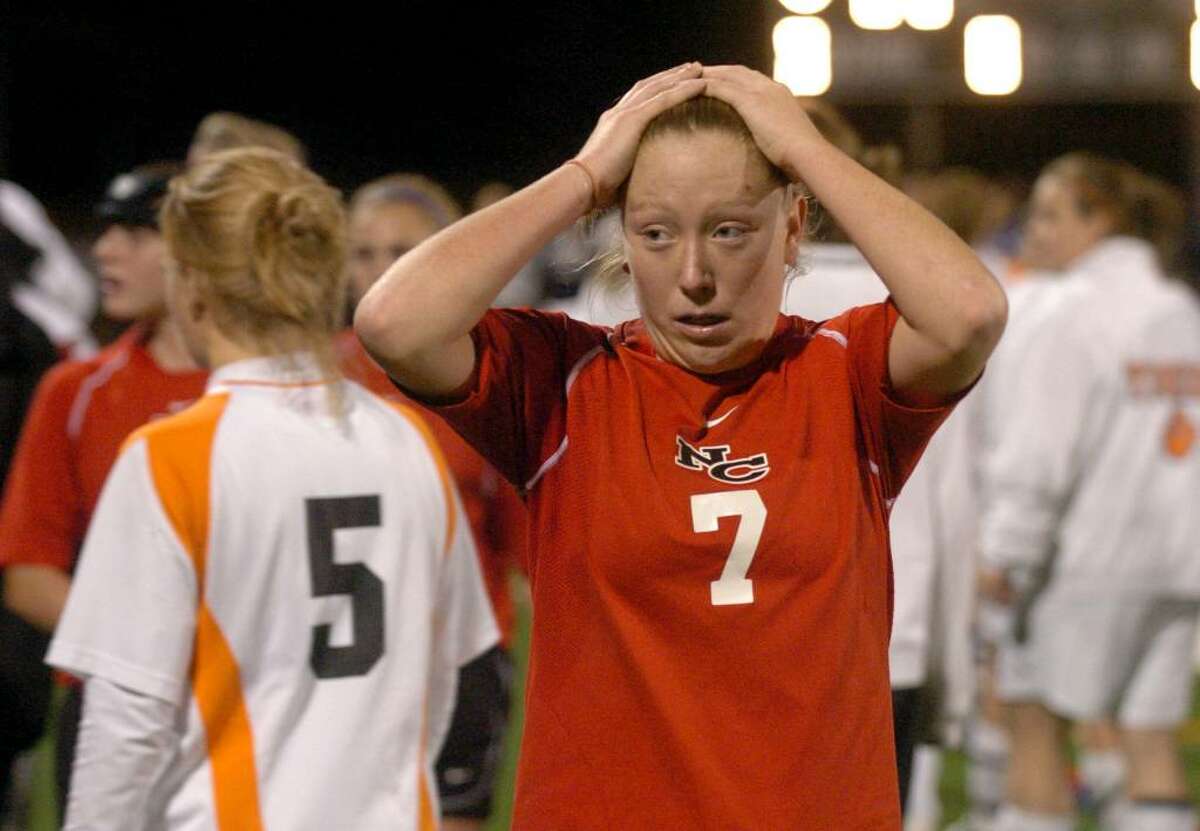 New Canaan's #7 Kasey Pippitt expresses disbelief after both New Canaan and Ridgefield were declared co-champions after double overtime with no score on either side, during FCIAC soccer in Norwalk on Wednesday Nov. 04, 2009.
