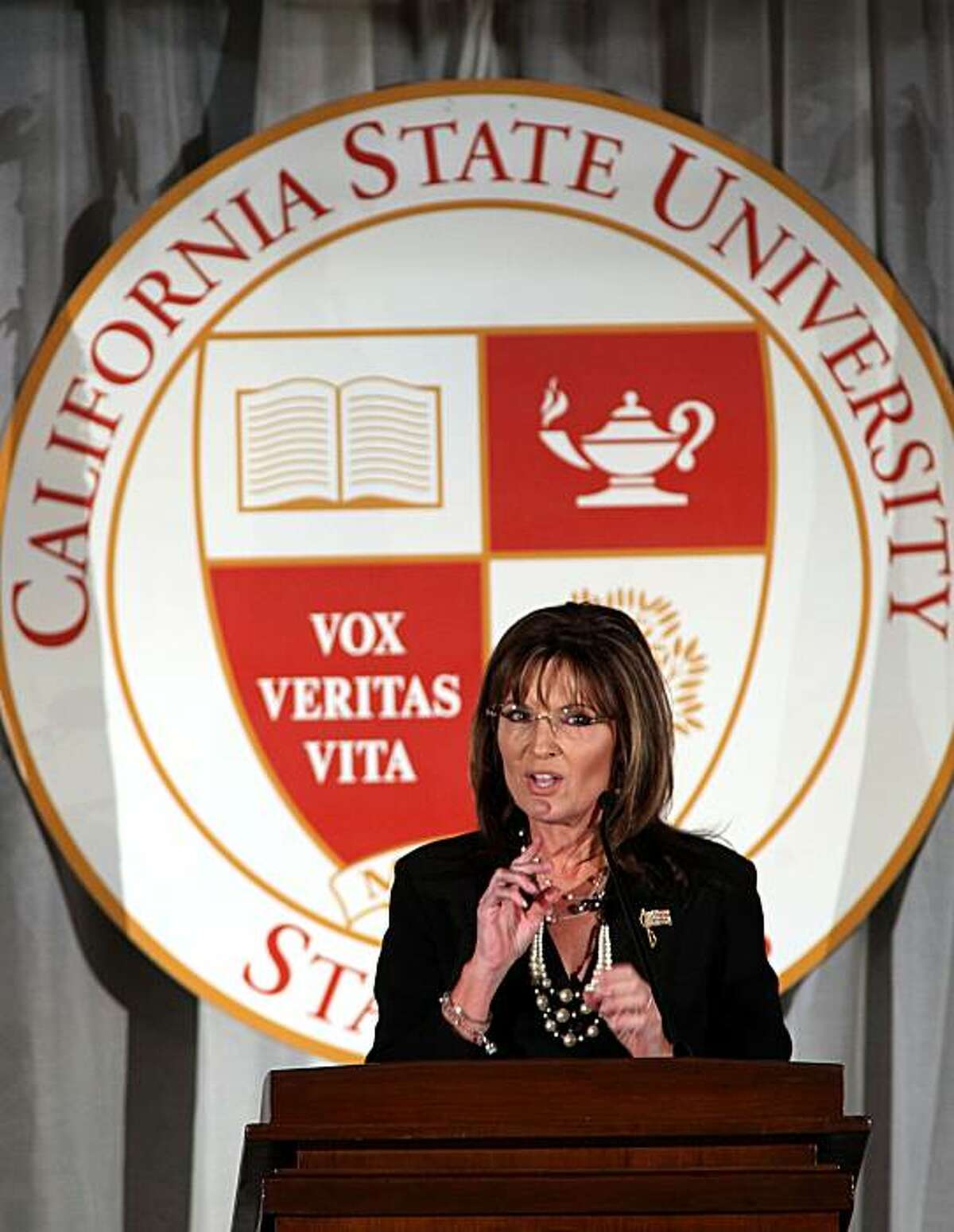 Former Republican vice presidential candidate Sarah Palin gestures during her speech at a fundraising dinner at California State University, Stanislaus in Turlock, Calif., Friday, June 25, 2010. Palin's speech has generated intense scrutiny since the nonprofit foundation holding the event first announced her visit in March. University officials have refused to divulge the terms of her contract or her speaking fee.