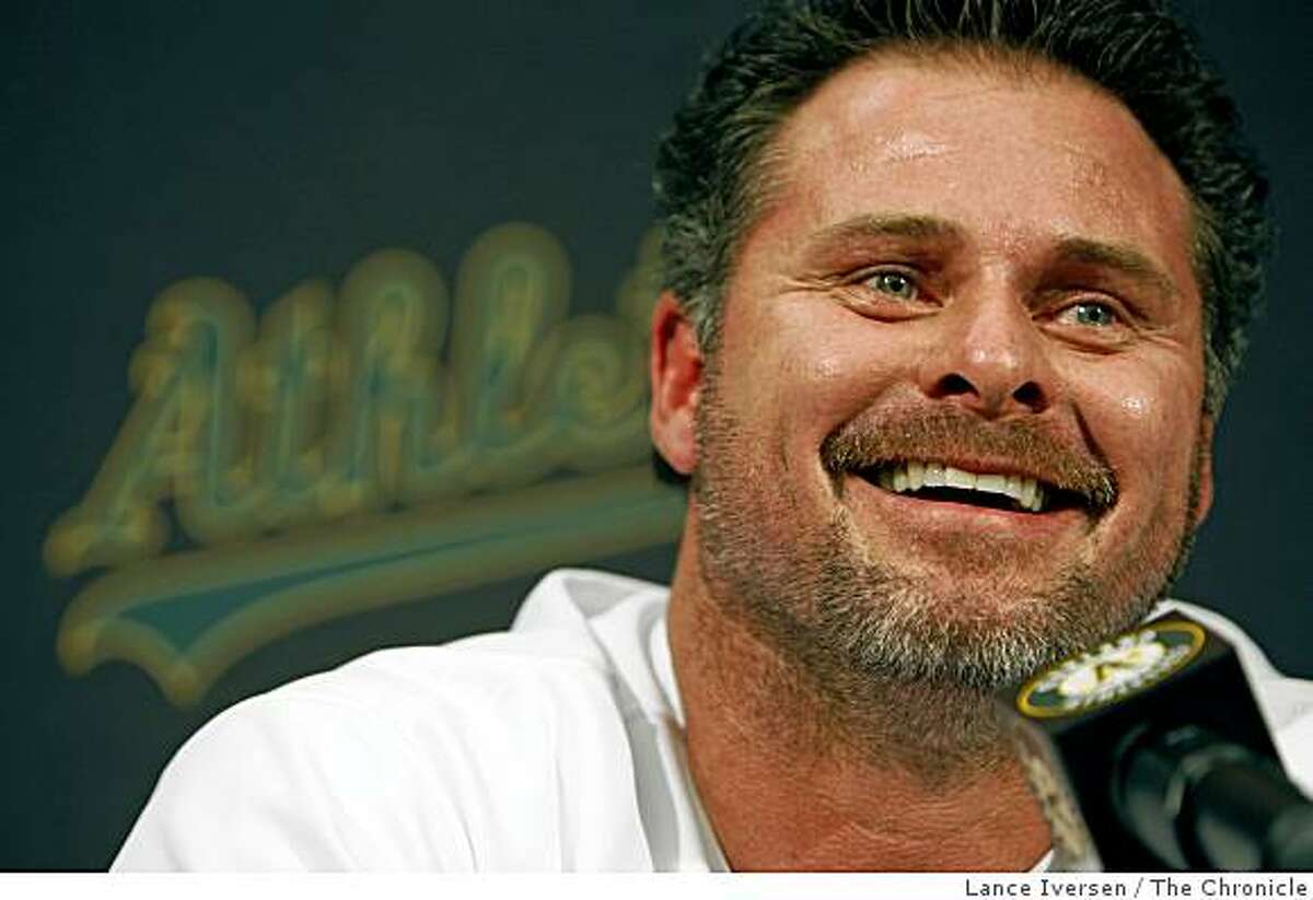 Oakland Athletics' Jason Giambi takes questions from the media at a news conference in Oakland, Calif., Wednesday, Jan. 7, 2009.