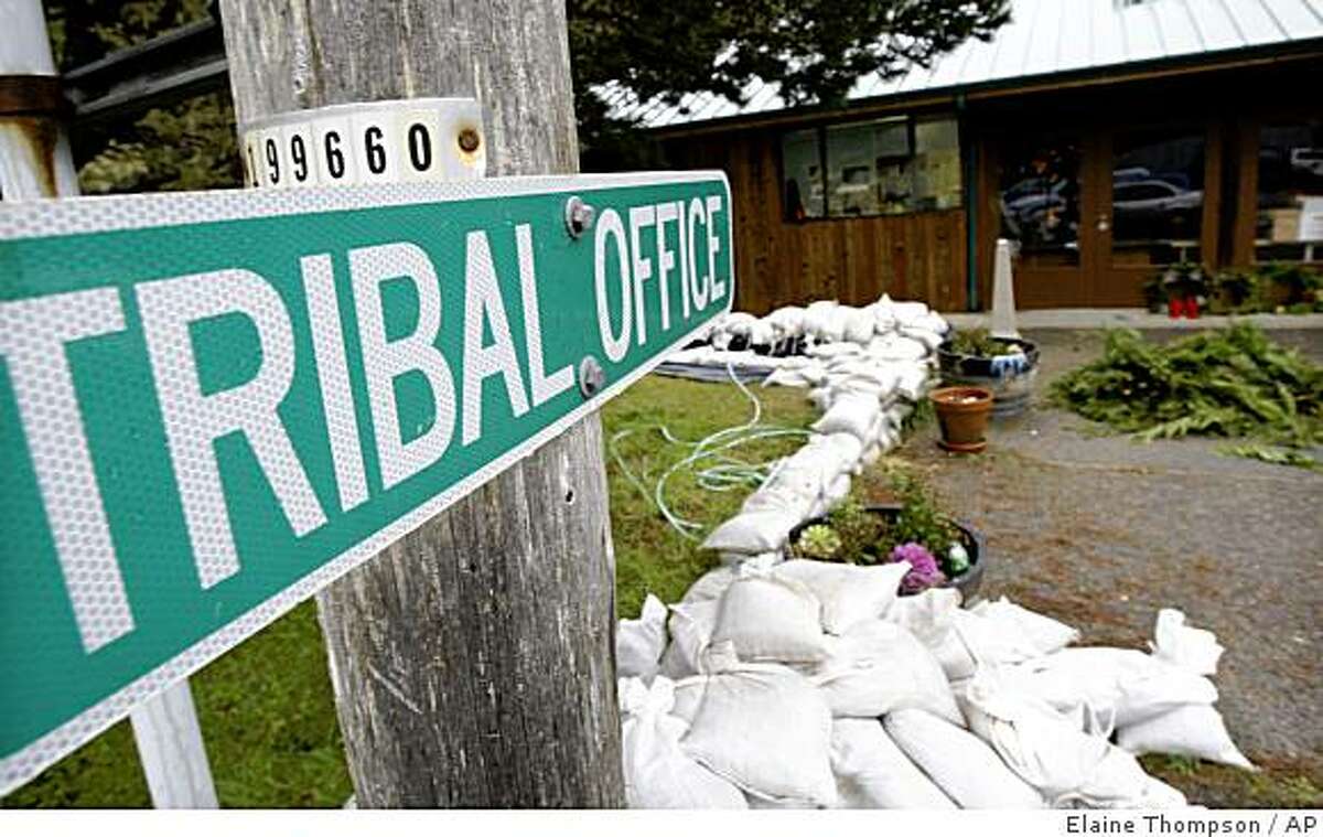 Sandbags surround the tribal center on the Hoh Indian Reservation, Dec. 9, 2008. Heavy rains and severe flooding used to be a problem every five or 10 years on the tiny reservation, but these days it's an annual event and plans are being made to relocate the entire village to higher ground. (AP Photo/Elaine Thompson)