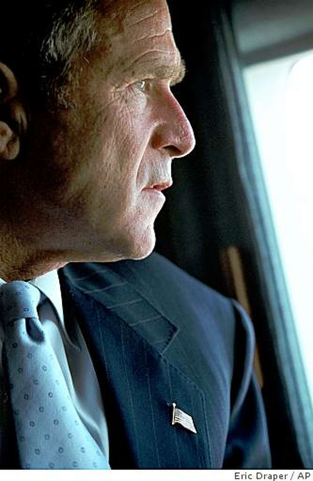 President Bush looks at the Pentagon in Washington from Marine One on his way to New York, Friday, Sept. 14, 2001. Bush faces one of the most complicated national security challenges ever to confront a U.S. president in the wake of Tuesday's terrorist attacks on the Pentagon and the World Trade Center towers in New York.