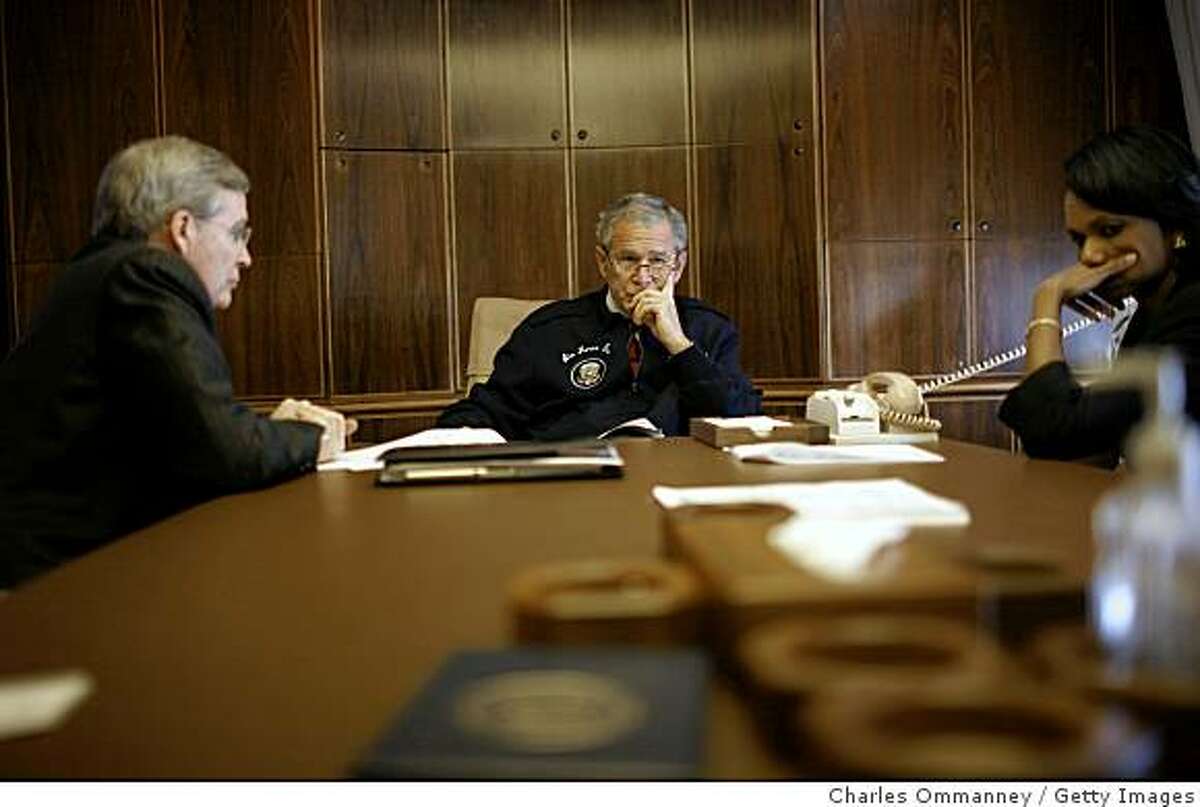 AIRFORCE ONE - JULY 14: 'EXCLUSIVE' US President Bush flanked by Secretary Rice and National security advisor Steve Hadley place a secure call on AF1 through to Jordan?s King Abdullah to discuss the worsening situation in the Middle East, on July 14, 2006 on route to St. Petersburg, Russia. Bush landed in St. Petersburg for talks with Russian counterpart Vladimir Putin and a summit of G8 leaders set to be dominated by the Middle East crisis. (Photo by Charles Ommanney/Getty Images)