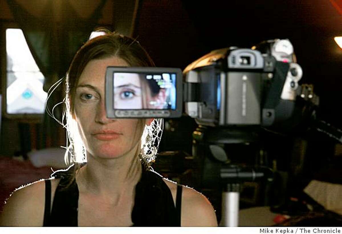 Tanya Vlach, a San Francisco artist who wants to become the first person to implant a video camera behind her prosthetic eye, poses for a portrait in her home on Thursday Dec. 11, 2008 in San Francisco, Calif.