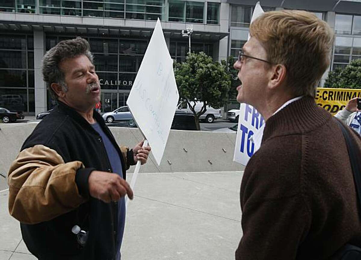 Proposition 8 supporter Mark Wassberg (left) and same-sex supporter Ron Weaver engage in a war of words at the Philip Burton Federal Building before Chief U.S. District Court Judge Vaughn Walker issues his ruling on the constitutionality of Proposition 8 in San Francisco, Calif., on Wednesday, Aug. 4, 2010.