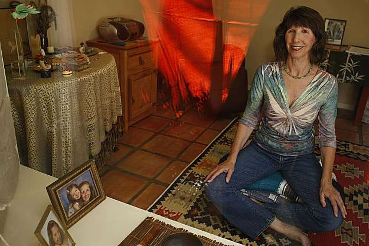Donne Davis, who started GaGa Sisterhood--a social network for enthusiastic grandmas--enjoys her daily mediation where her grandchildren's pictures are displayed for inspiration to meditate on flexiility of body and mind at her home in Menlo Park, Calif., on Monday, August 2, 2010.