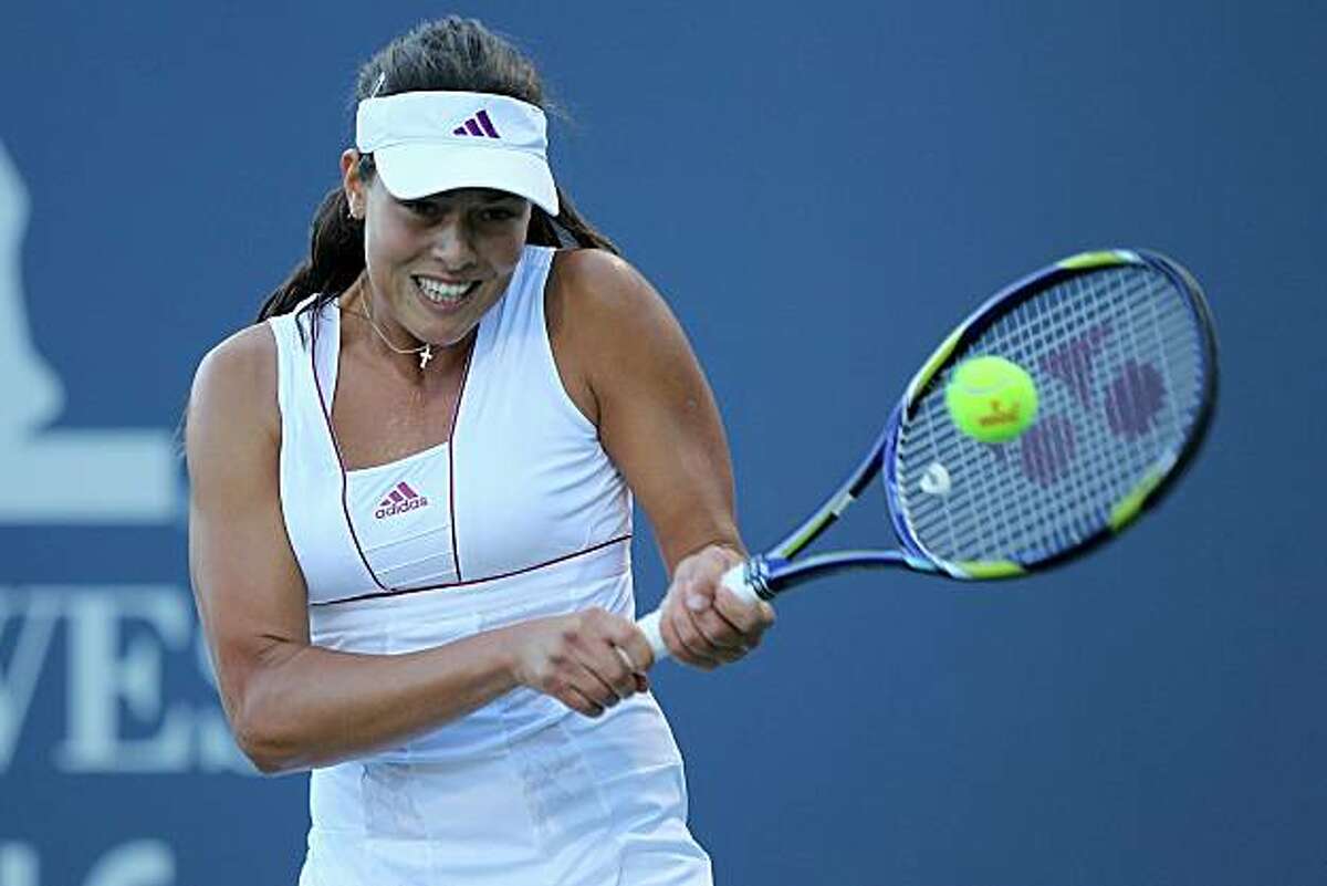 STANFORD, CA - JULY 26: Ana Ivanovic of Serbia returns a shot against Alisa Kleybanova of Russia during Day 1 of the Bank of the West Classic at Stanford University on July 26, 2010 in Stanford, California.