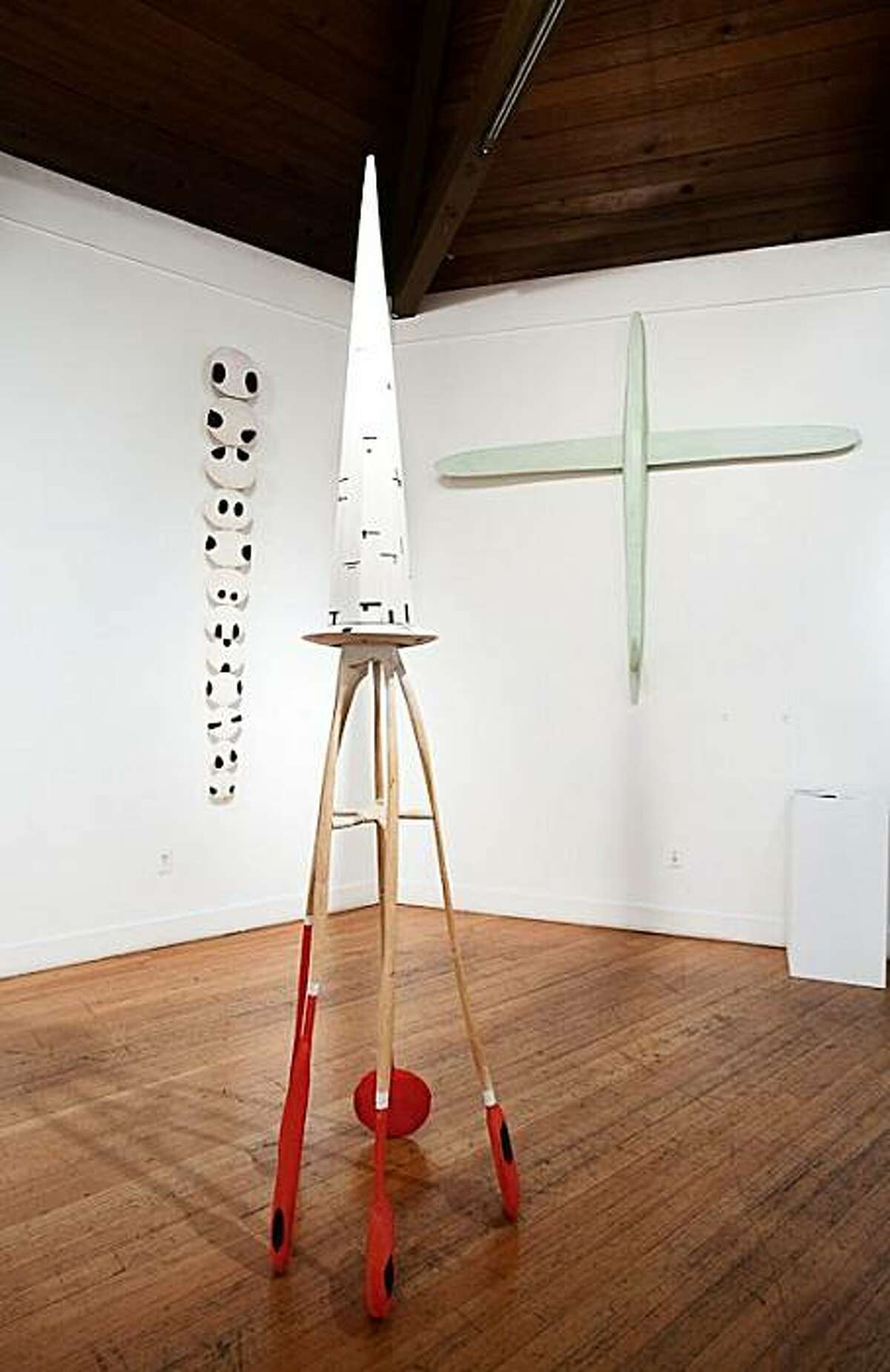Installation view of "Local Treasures: Six Extraordinary Artists" at Berkeley Art Center, showing (l. to r.) "Towtom," "Area 51" and "Stead" (all undated) wood sculpture by Robert Brady