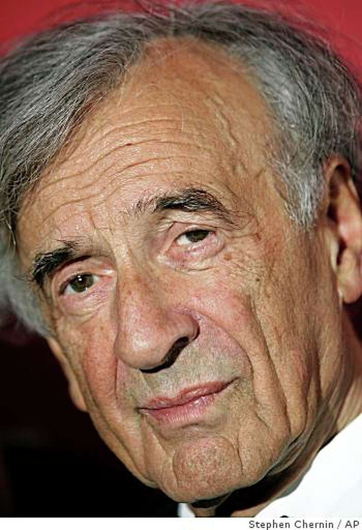 **FILE** Elie Wiesel, 1986 Nobel Prize winner arrives at the Time 100 gala, in this May 8, 2007 file photo at the Time Warner Center in New York. A man charged with dragging Wiesel from a hotel elevator apologized in court Monday Aug. 13, 2007 to the Nobel laureate over the alleged anti-Semitic attack. (AP Photo/Stephen Chernin,File)