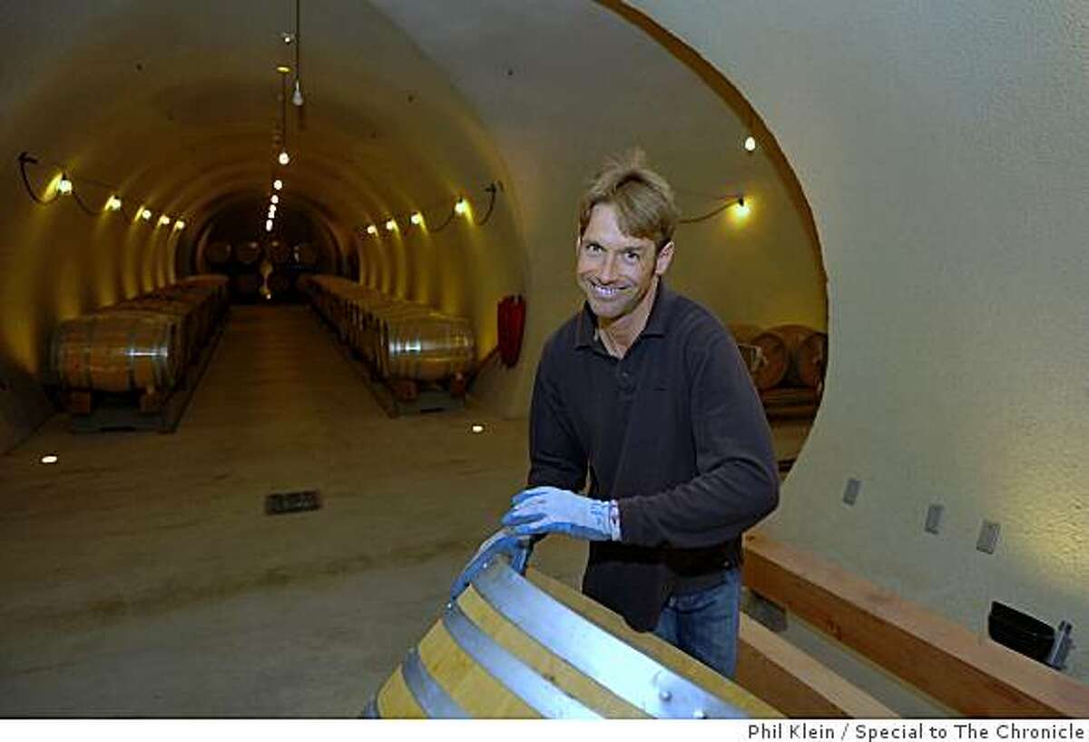 Winemaker Nick DeLuca rolls a wine barrel inside the newly built underground wine cellar at the Star Lane vineyard in Santa Ynez on Tuesday, Dec. 9, 2008. Photo/Phil Klein