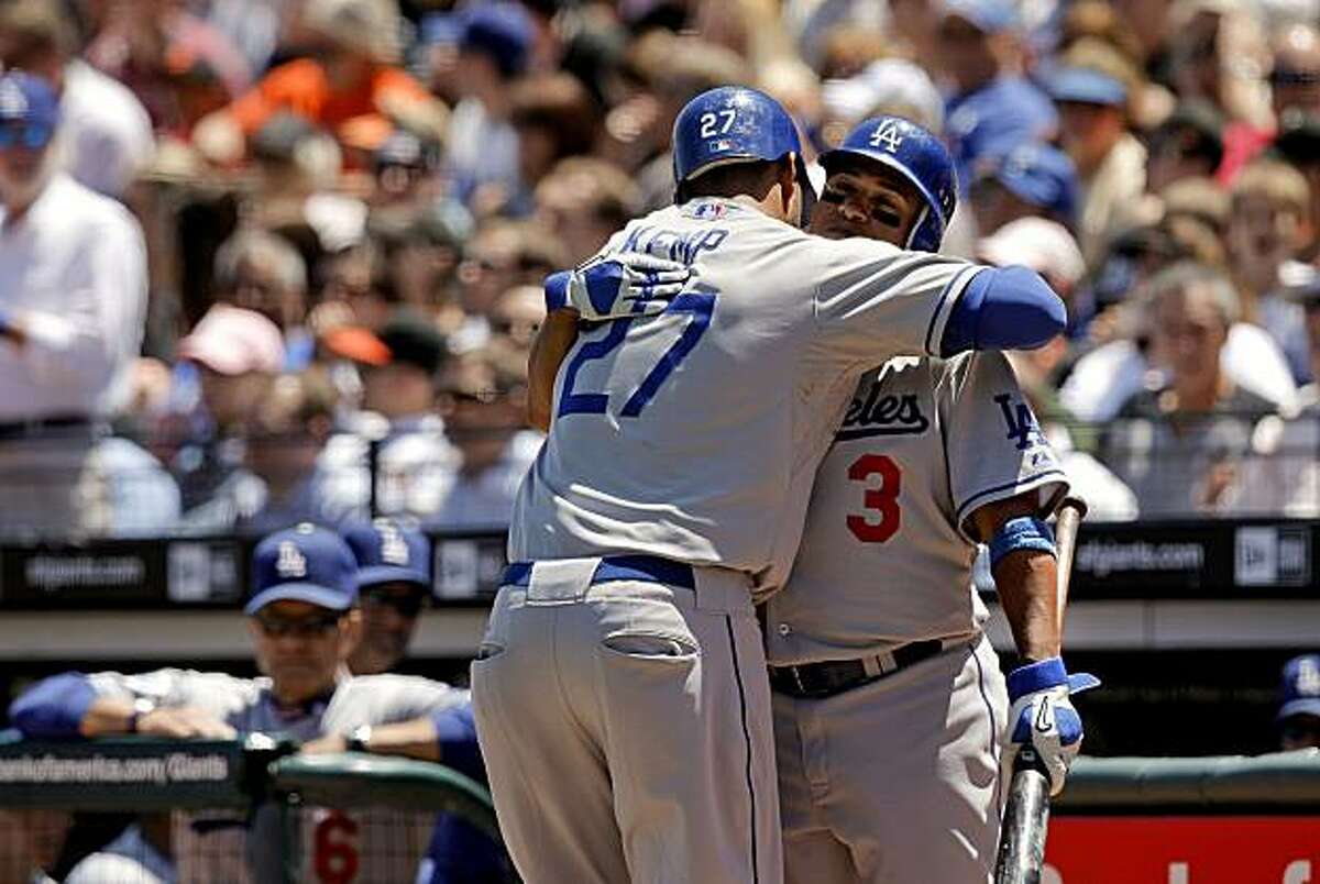 The Dodgers' Matt Kemp celebrates his solo home run in the fifth inning with Ronnie Belliard (3) in San Francisco on Wednesday.