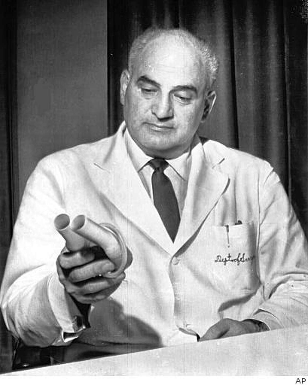 ** FILE ** In this May 23, 1966 file photo, American heart specialist Dr. Adrian Kantrowitz displays a mechanical auxillary heart, like the one he implanted in Mrs. Louise Ceraso, in a New York hospital, six days previous, during a news conference in New York. Dr. Kantrowitz, who performed the first human heart transplant in the United States in 1967 and pioneered development of mechanical devices to prolong the life of patients with heart failure, died in Ann Arbor, Mich., Friday, Nov. 14, 2008. He was 90. (AP Photo, File)