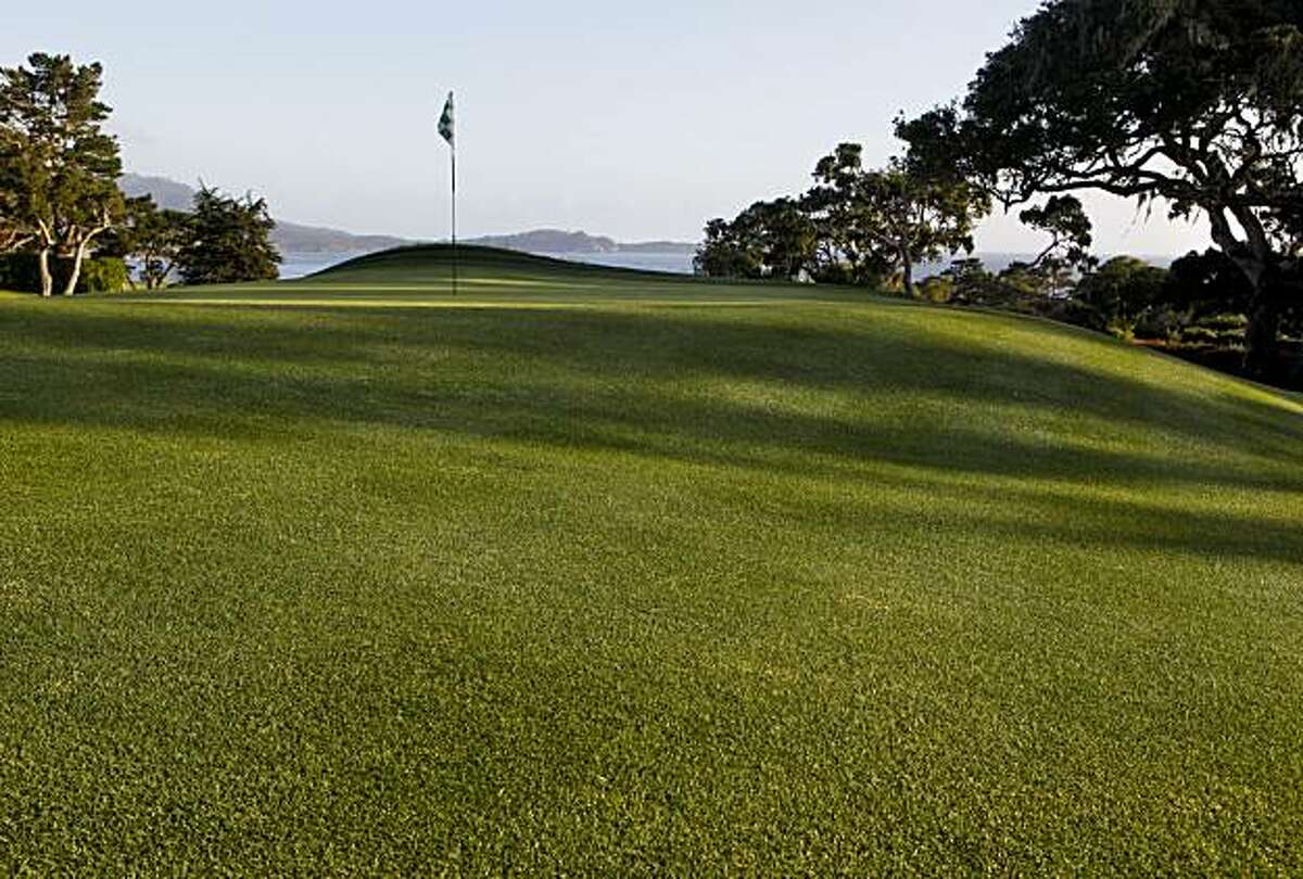 The dramatic sloping green of the par-5 14th hole at the Pebble Beach Golf Links on Monday May 10, 2010, in Pebble Beach, Calif.