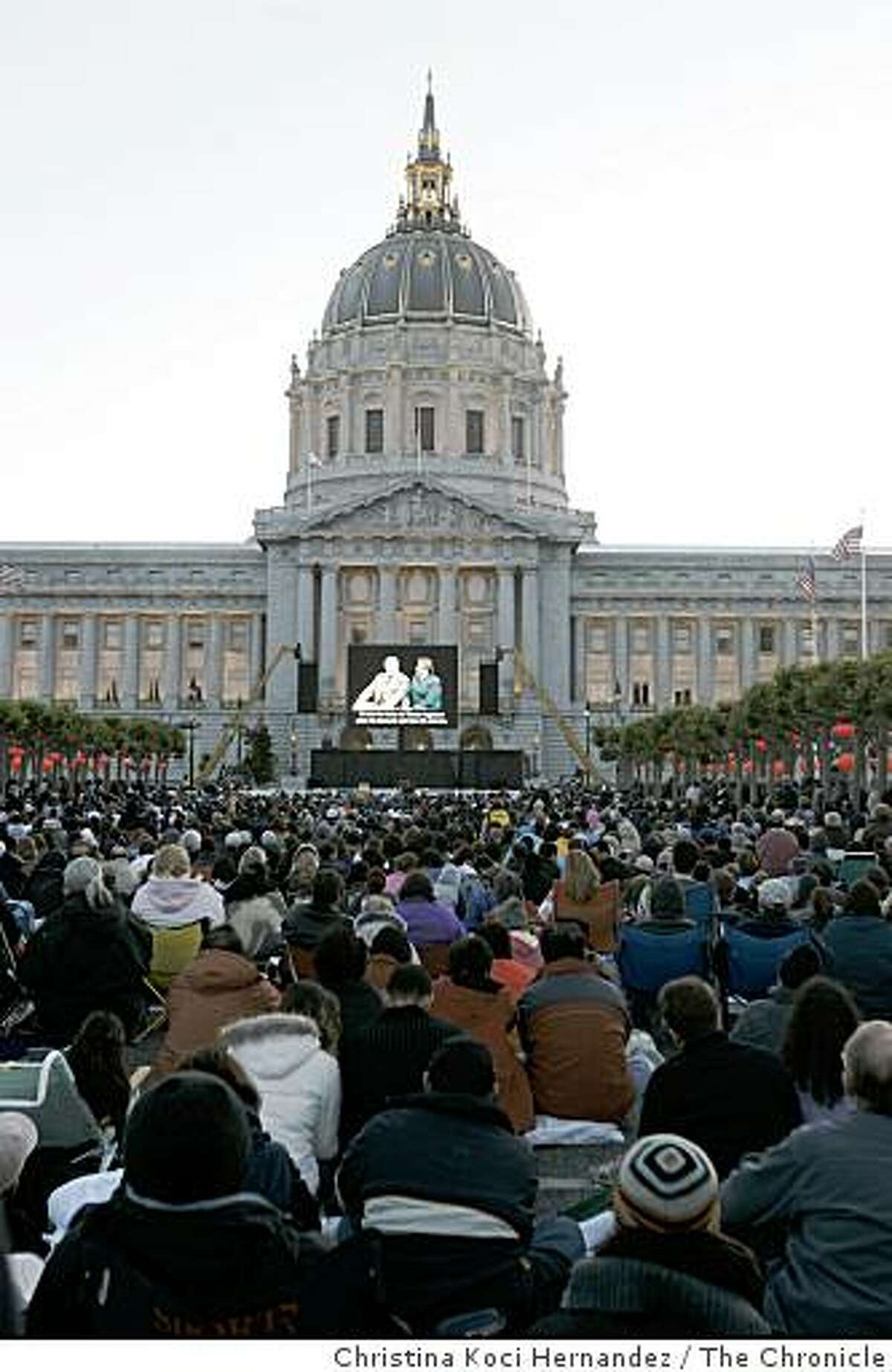 An outdoor audience, at San Francisco's Civic Center Plaza, enjoys a simulcast broadcast of San Francisco Opera's new production of Madama (cq) Butterfly. In this first new experiment to shake up and generate new audiences, the San Francisco Opera - under new general manager David Gockley- simulcasts the world premiere of this production of "Madama(cq) Butterfly" on a single, 16-foot x 24-foot LED screen.