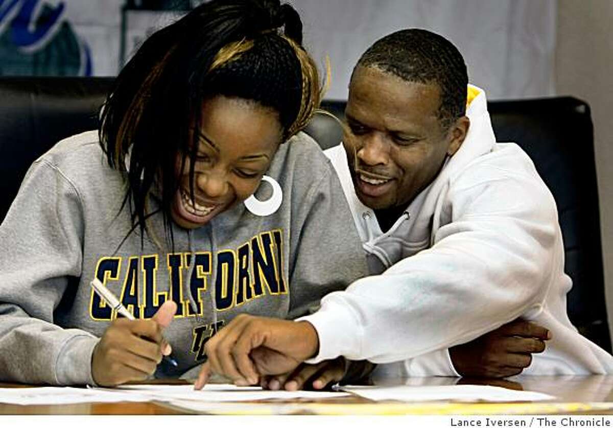 Tierra Rogers announced Wednesday she will play basketball for University of California at Berkeley next year. Rogers a Sacred Heart Cathedral player gets a little help from her God Father Guy Hudson as she signed a letter of intent during a ceremony that honored five Sacred Heart Cathedral athletes Wednesday November 12, 2008
